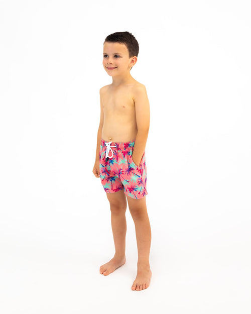 Sharkies Swimwear Falling Palms Positano Swim Shorts featuring a tropical palm print design with vibrant colors. Perfect for beach and poolside wear.
