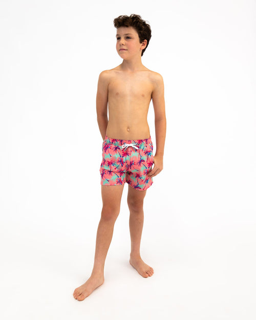 Sharkies Swimwear Falling Palms Positano Swim Shorts featuring a tropical palm print design with vibrant colors. Perfect for beach and poolside wear.