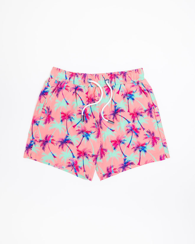 Sharkies Swimwear Falling Palms Positano Swim Shorts featuring a tropical palm print design with vibrant colors. Perfect for beach and poolside wear.