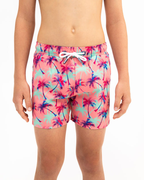 Sharkies Swimwear Falling Palms Positano Swim Shorts featuring a tropical palm print design with vibrant colors. Perfect for beach and poolside wear.