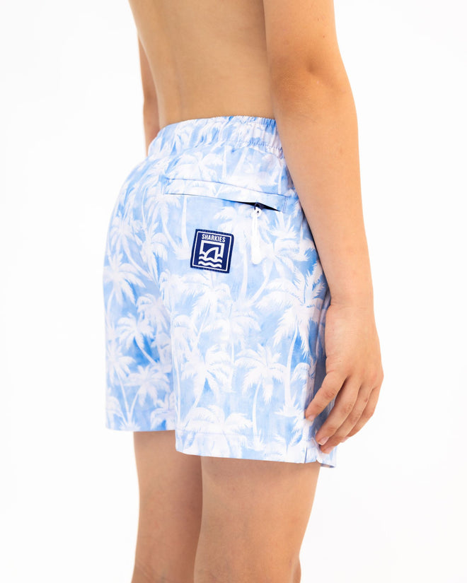 Sharkies Swimwear Maui Palm Swim Shorts featuring a tropical palm leaf pattern in vibrant colors. Stylish and comfortable swimwear perfect for beach and pool activities.