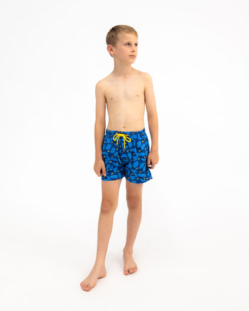 Sharkies Swimwear Boys Swim Shorts featuring a playful feather and stork print. Bright and colorful design ideal for young boys, perfect for swimming and beach outings