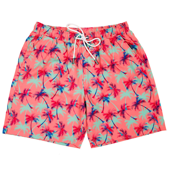 Men's swim shorts featuring a tropical print with falling palm trees against a pink background. The shorts have an elastic waistband with a drawstring and a back zipped pocket, designed for a relaxed, beach-ready look.